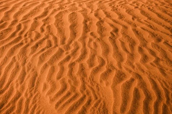 Structure in the desert sand.Dunes orange background.Huge dunes of the desert.Sand dunes of Dubai.