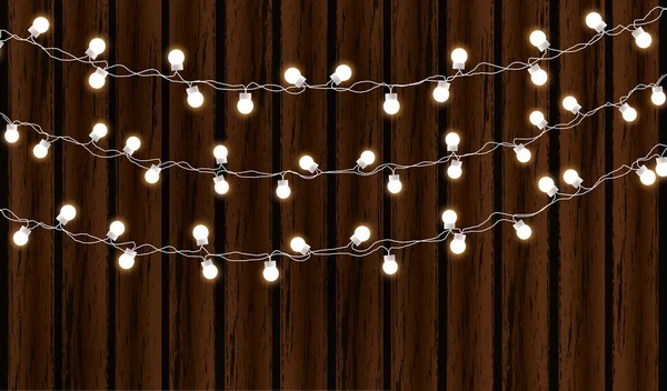 Christmas lights isolated on dark wooden background. Glow garland. Vector glow xmas light bulbs on wires. — Stock Vector