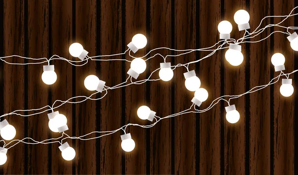 Christmas lights isolated on dark wooden background. Glow garland. Vector glow xmas light bulbs on wires. — Stock Vector