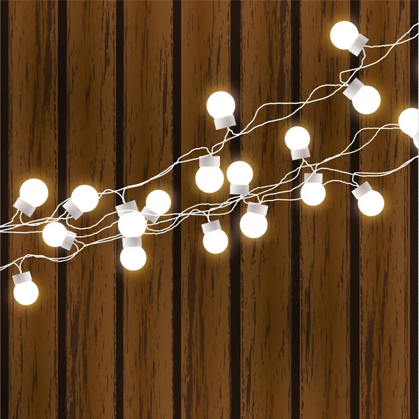 Luces de Navidad aisladas sobre fondo de madera oscura. Guirnalda brillante. Vector brillo bombillas de Navidad en los cables . — Vector de stock