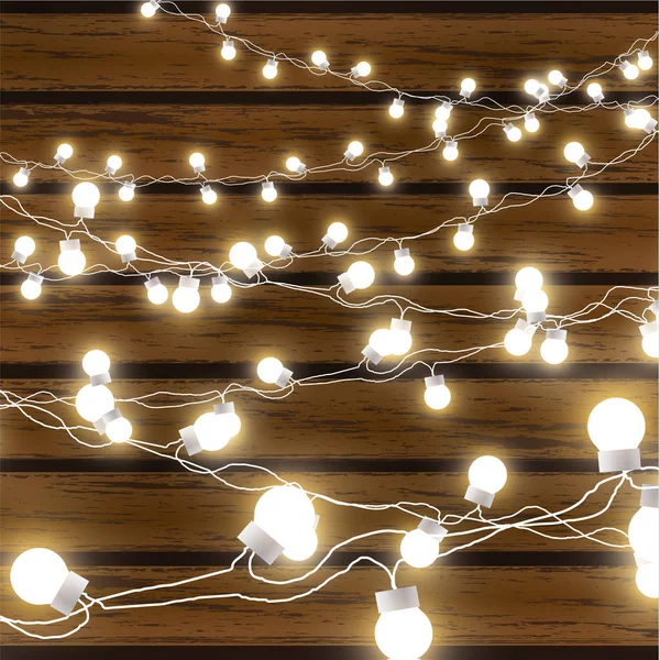 Christmas lights isolated on dark wooden background. Glow garland. Vector glow xmas light bulbs on wires. — Stock Vector