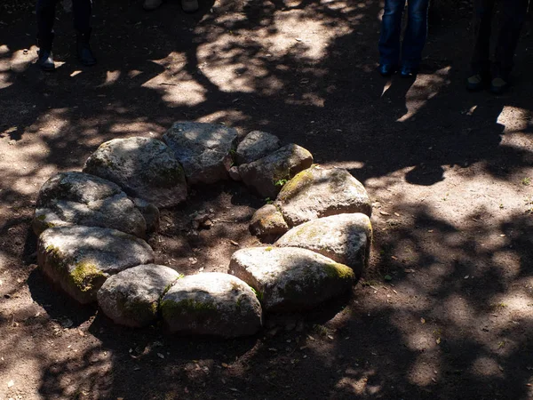 megalithic circle and large circular hut in the archaeological site of Noddule - Nuoro Sardinia , ITALY.