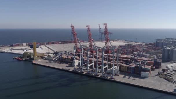 Aerial view of Industrial trading port infrastructure with containers and lifting cranes on Black Sea coast — Stock Video