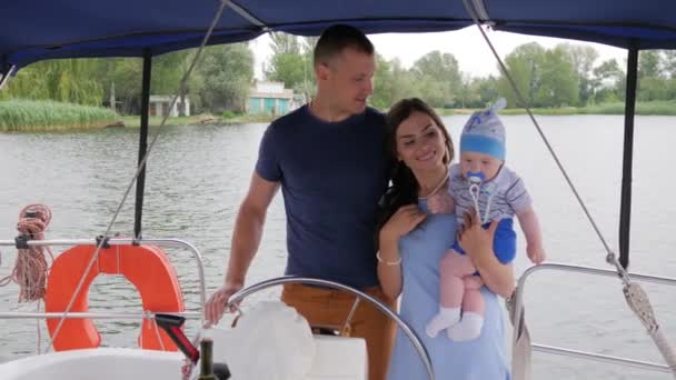 Mum,dad and son in open air, happy parents with child on rest in background nature and water, mother, father and little baby — Stock Video