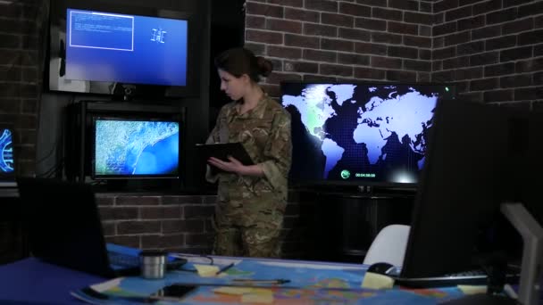 Portrait woman soldier with tablet, against background — Stock Video