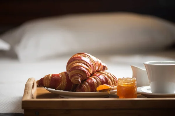 Breakfast on a bed in a hotel room. Bedroom, meal.