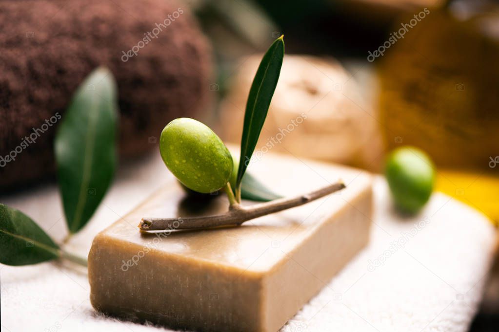 Natural spa with olive oil bar soap and towels