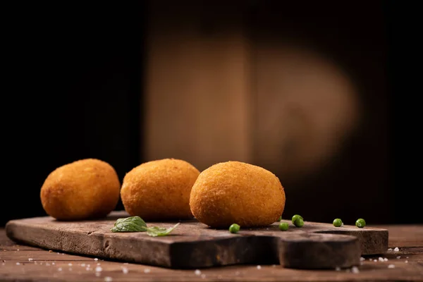 Arancini - italian rice balls which are coated with bread crumbs — Stock Photo, Image