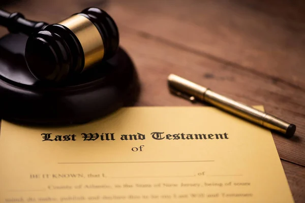 Last will and testament form with gavel. Decision, financial