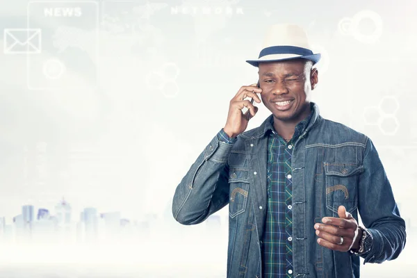 Young american african guy with cell phone. Handsome man