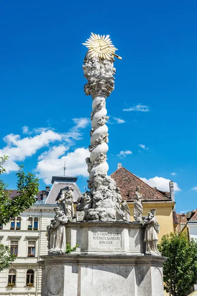 Magnificent baroque column in Sopron, Hungary. Holy trinity statue. Religious architecture. Artistic object. Travel destination.