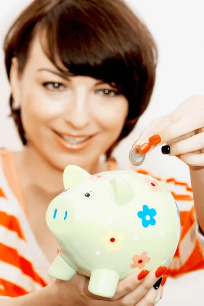 Young Caucasian Woman Gives Euro Coin Decorative Ceramic Piggy Bank — Stock Photo, Image