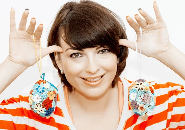 Young woman joking with easter eggs — Stock Photo, Image