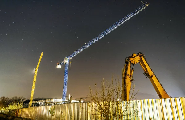 Construction cranes, Nitra, Slovakia, night scene