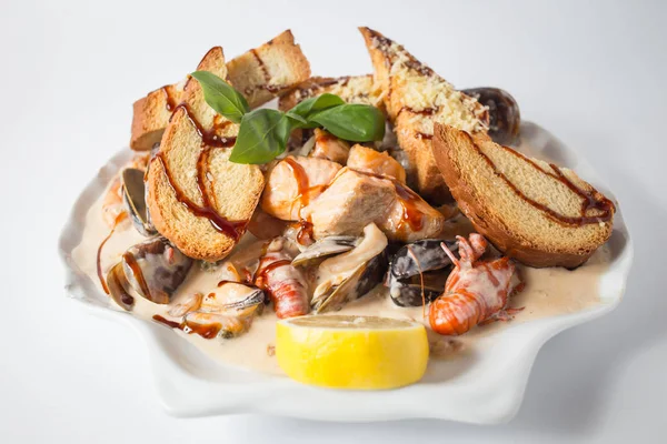 Seafood chateau with crayfishes, mussels, cheese and lemon.