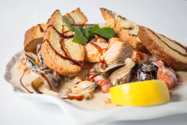 Seafood chateau with crayfishes, mussels, cheese and lemon.