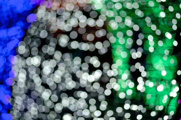 Colorido desenfoque bokeh hadas calle luz festival, noche desenfocada — Foto de Stock