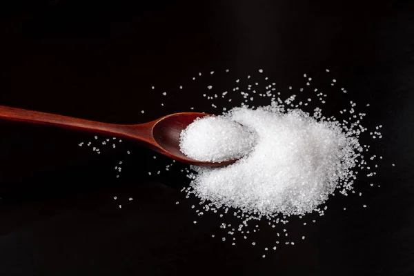 Brown Wood Spoon Pile White Salt Crystals Isolated Black Background Stock Picture