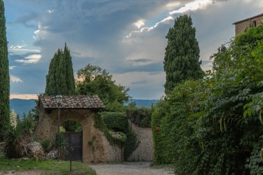 Entrance to a villa in in a village of medieval origin. Volpaia, Tuscany, Italy clipart