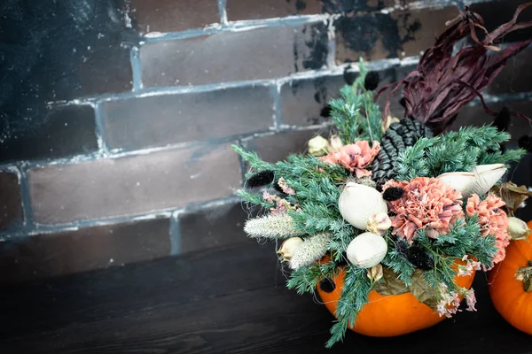 Halloween or Thanksgiving background. Autumn composition in pumpkin with cobweb, corn, carnation flower with copy space.