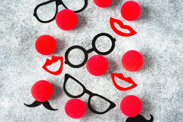 Red Nose Day, red noses with glasses, moustache. Toned deep negative.