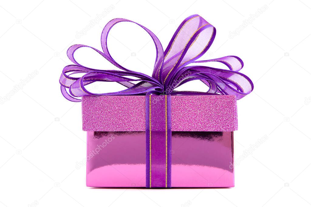 A beautiful purple gift box with delicated purple and golden ribbon, isolated on white background. A present for Holidays, Christmas, New Year, Valentine's, Birthday, Anniversary or any special occation concept.