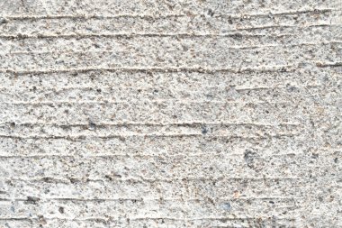 Beton yoldaki çizgilerin yakın görüntüsü. Soyut yüzey arkaplanı.