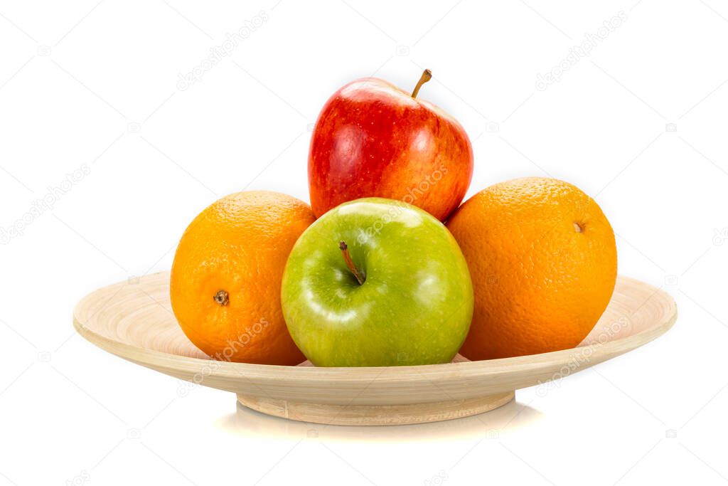 Fresh fruits  on a bamboo plate, isolated on white background. 