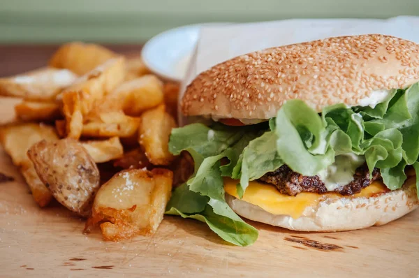 Beef Cheeseburger Fried Potato Chunks Ranch Dipping Sauce Wood Plate — Stock Photo, Image