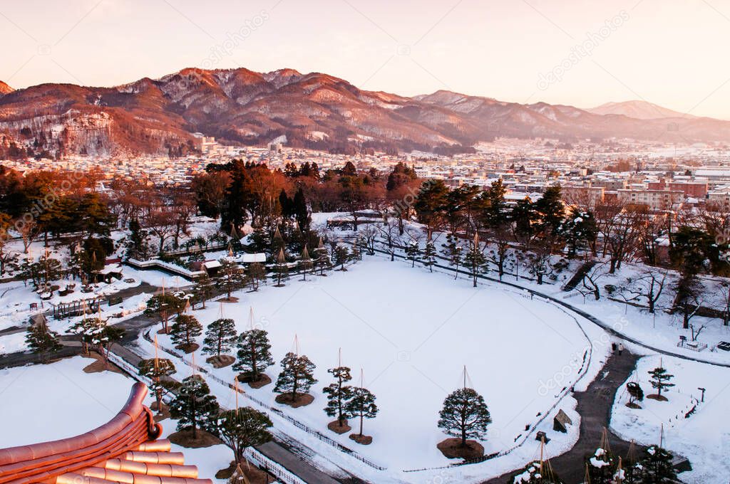 Sunset view of Aizu Wakamatsu city and castle park from aerial angle with beautiful evening light