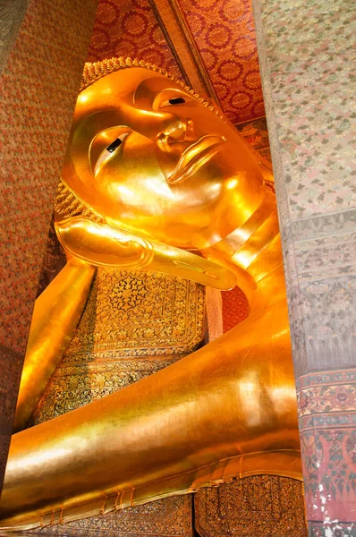 Golden Reclining Buddha at Wat Pho, Bangkok, Thailand.