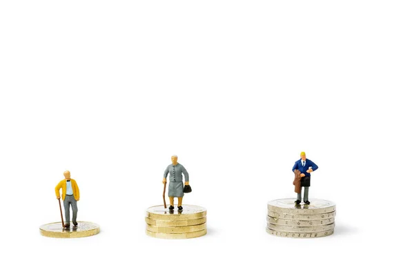 Small figurines and stacks of Euro coins on bright background. Economic inequality by gender. Inequality, starvation wages and income concept. Gender pay gap.