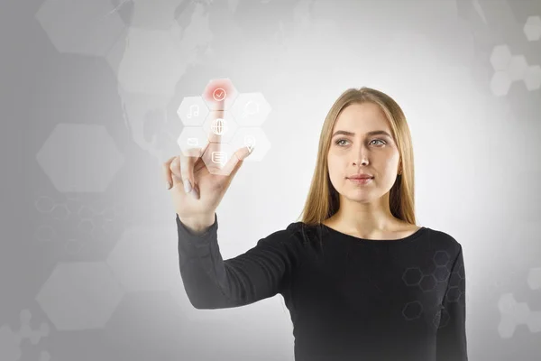 Young woman in black is pushing the button. Innovative technolog — Stock Photo, Image