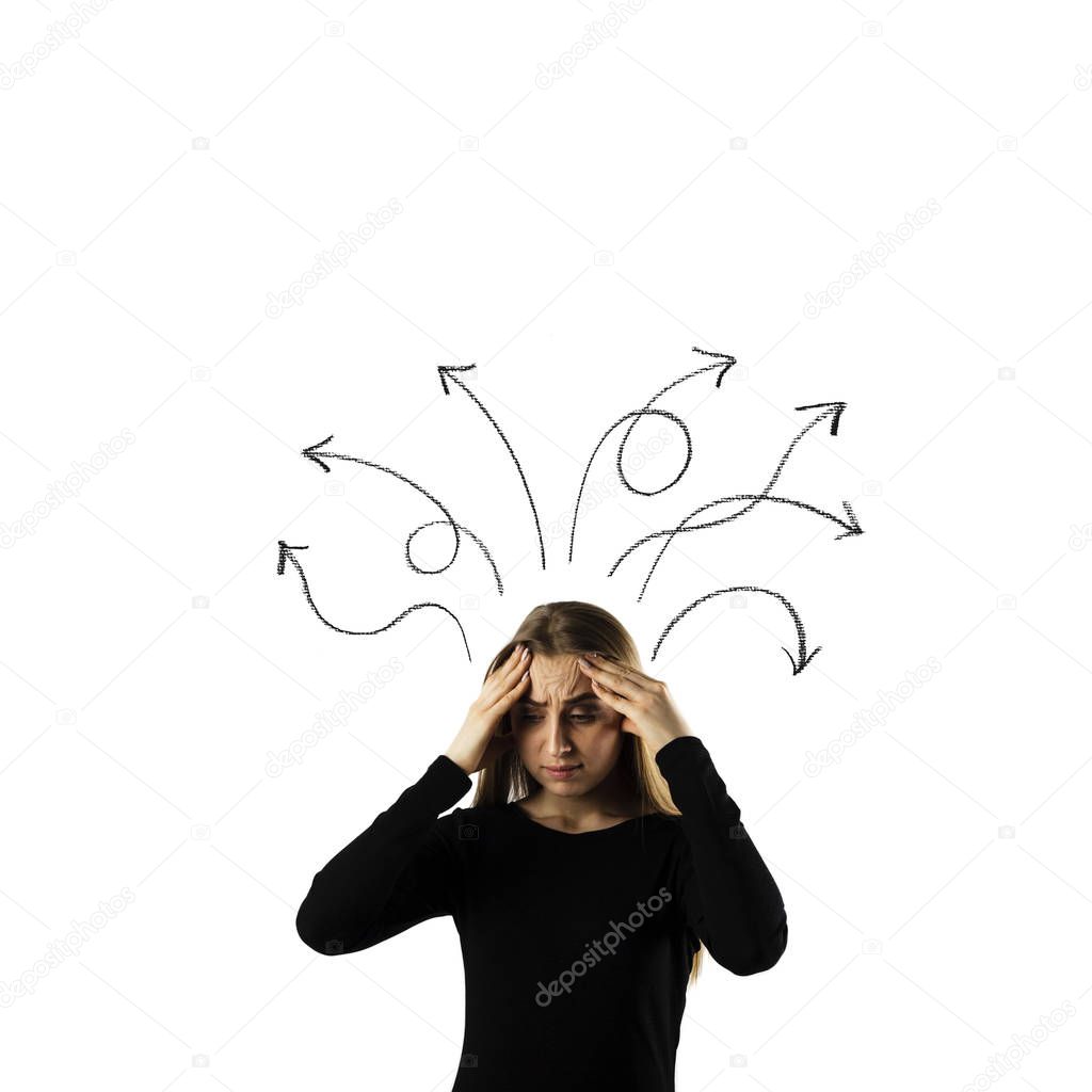 Frustrated young woman in thoughts. Arrows over her head.