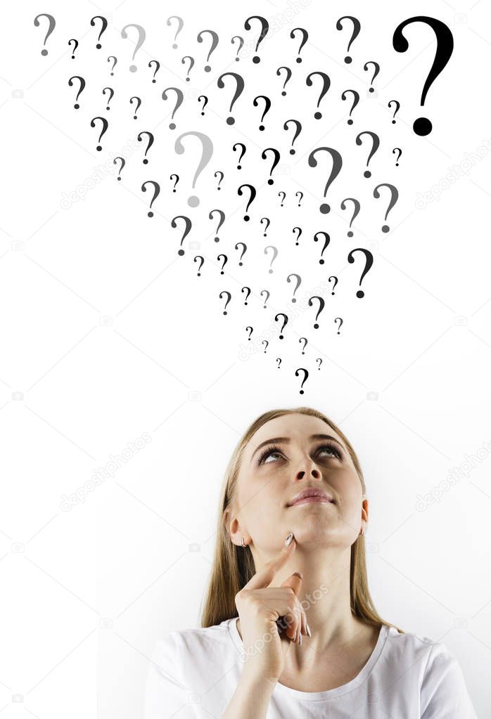 Young woman in white and question marks.