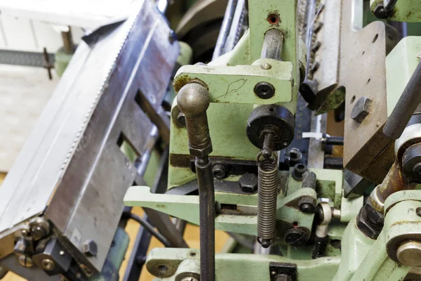 Machine for stitching book pages. Elements of the machine. — Stock Photo, Image