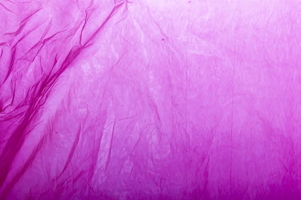 Pink plastic shopping bag as background. — ストック写真