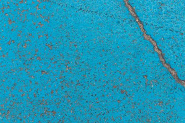 Arka plan olarak asfalt boya. Mavi renk. Park yerinde doku. Sokak.