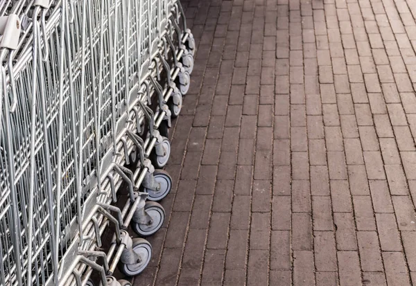 Trolleys. Row of shopping trolleys or carts near supermarket.
