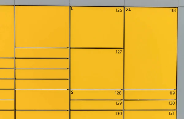 Post office box. Yellow post box for rentals. Post box lockers for parcels that the recipient can pick up there. Pack station.