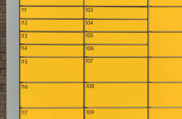 Post office box. Yellow post box for rentals. Post box lockers for parcels that the recipient can pick up there. Pack station.