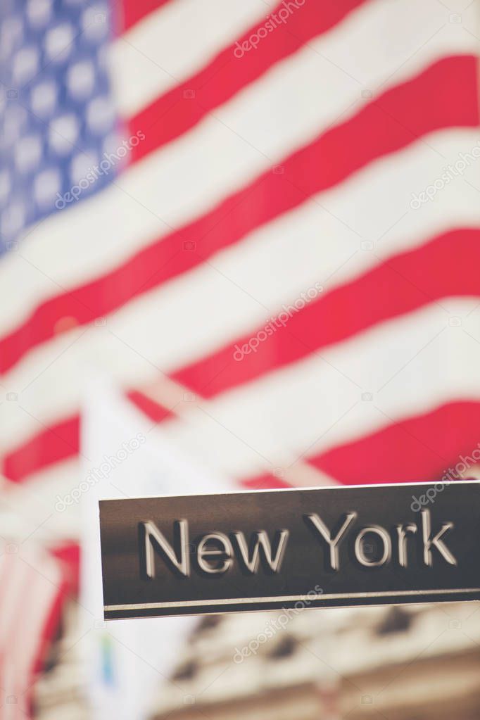 New York sign with New York Stock Exchange flag background 