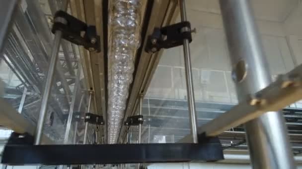 Plastic bottles are moving along the conveyor for filling — Stock Video