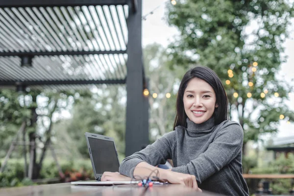 Modern business woman in the coffee shop with copy space