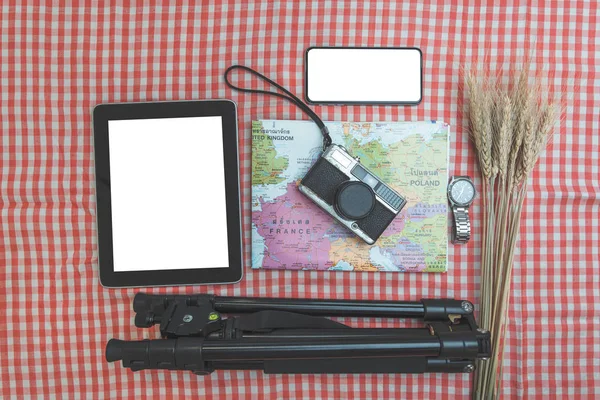 time to travel concept, wanderlust vacation background flat lay, space for text. camera sunglasses passport map phone on white wooden table. planning summer holiday