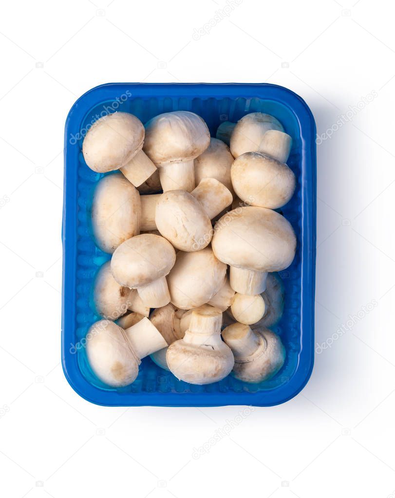 fresh mushroom champignons in a basket isolated on white background