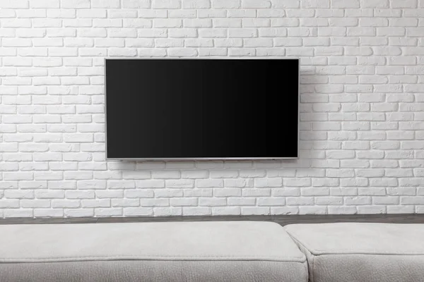 Big TV on the white wall — Stock Photo, Image