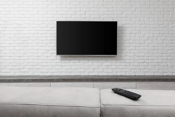 Big TV on the white wall — Stock Photo, Image