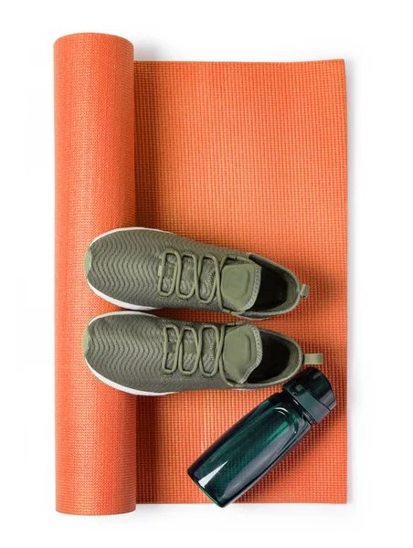 Sport shoes and yoga mat — Stock Photo, Image