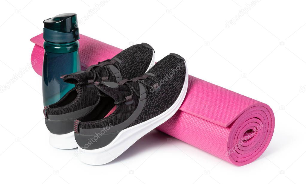 Sport shoes and yoga mat